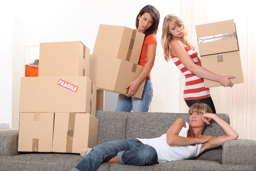 Staff preparing labelled boxes and equipment for an office move in Abbey Wood